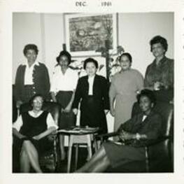 Virginia Lacy Jones with a group of women in a living room.