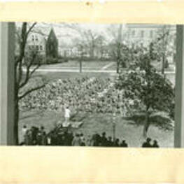 Students participate in gymnastics. Written on recto: Mass Gymnastics, Spelman College Founder's Day, April 11, 1937.