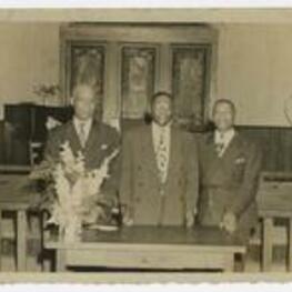 Indoor group portrait of three men. Written on verso: Layman's Annual Retreat at the Texas Conference, 1949.