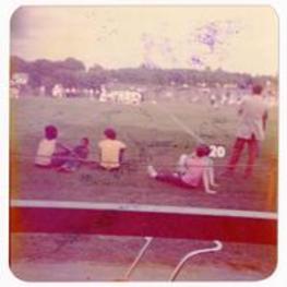 Football game. Written on verso: Note Beth Angela sitting. Phillip's football [?].