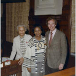 Grace Townes Hamilton stands by her desk with an unidentified man and woman at the Georgia House of Representatives.
