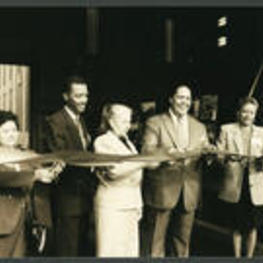 Maynard Jackson and others cut a ribbon honoring a building opening.