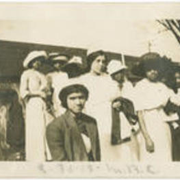 A group of women stand in a crowd at Morris Brown College. Written on recto: 3-30-12, M. B. C.