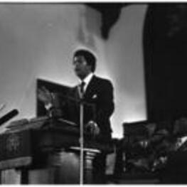 Maynard Jackson addresses people in a church.
