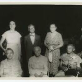 Group portrait of J. Murphy with Mrs. Yate and others.