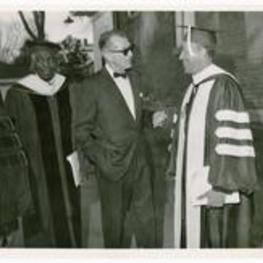 Benjamin Mays stands with Hugh Morris Gloster and an unidentified man talking.