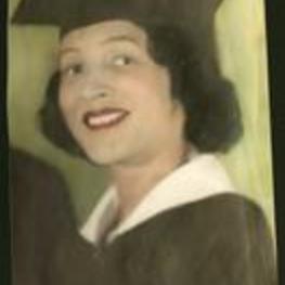Juanita M. Eber is shown wearing a cap and gown.