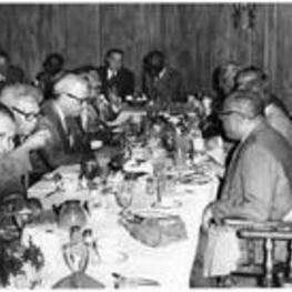 Men sit at a table and eat at a breakfast honoring California Judge David W. Williams.
