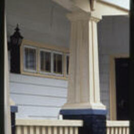 A close up view of a porch. Text from slide presentation: supported by tapered or square columns.