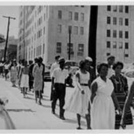 A group walks down the street in Atlanta.