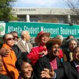 A group celebrates at the dedication of Atlanta Student Movement Boulevard.