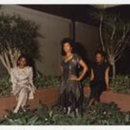 Outdoor group portrait of three women standing. Written on verso: "Miss Morris Brown College + Court 1988; L to R Pamela L. Daniels, Juliette Burgess, Connie F. Spencer".