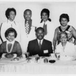 Virginia Lacy Jones with Edward A. Jones and Halle Brooks at ALA sponsored event. Written on verso: Virginia L. Jones (left), Edward A. Jones (2nd row; 2nd from left), Hallie Brooks (2nd row right).