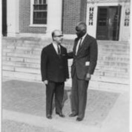 Armeriak Boyavion and Benjamin E. Mays stand outside of a building on the Morehouse campus.