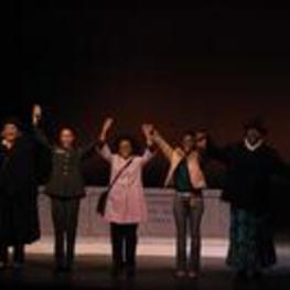 Group portrait of women on stage.