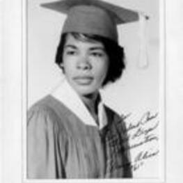 Portrait of a young woman wearing a cap and gown. The photo has been personalized to a Rev. [Robert] Penn. Written on verso: To Rev. [Robert] Penn with deep appreciation, Mary Alice "61".