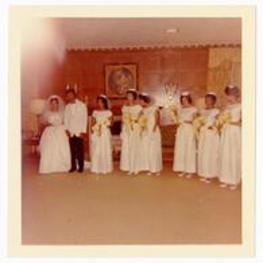 Wedding photo of the bride, groom, and bridesmaids. Written on verso: Members of Wedding Party. Wedding of Beth Chandler Theodore John Warren Jr.