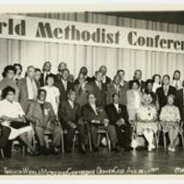 Group portrait of men and women on a stage. Written on recto: Twelfth World Methodist Conference Denver Colo. Aug. 16- 1971.