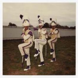 Out door group portrait. Written on verso: "From left to right; 1. Harold Rogers, 2. Quincy Cason, 3. Roderick Blake; Morris Brown Clg. Drum Majors 1985".