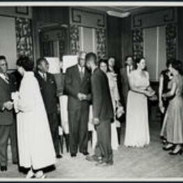 Ernestine Walton Brazeal (facing front, first from right) stands in a reception greeting line with Dr. Benjamin Mays (facing front, center) and Mrs. Sable Mays (facing front, second from right) and others.