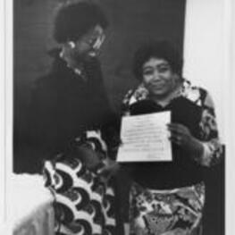 Two unidentified women, one holding a Voter Education Project Fellow certificate.