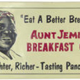 Image of Aunt Jemima on a metal advertisement sign.