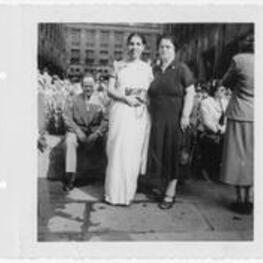 Two women standing in a plaza. Written on verso: April '53 With Mrs. Richleu at Rockefeller Center New York. Ivy.