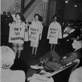 View of three women with picket signs.