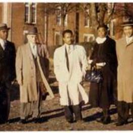 Anna E. Hall standing outside with four men. Written on verso: Rev. Short, GA; Rev. Fields, LA: Rev. Meerans, D.C; Miss Hall; Jackson, LA.