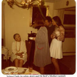 View of Velma Clark and Dr. Boll's mother at a graduation party. Written on recto: Velma Clark (in white skirt) and Dr Boll's Mother (seated).
