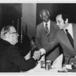 Benjamin E. Mays and others at an APCUG Higher Education Awards Banquet. Written on verso: APCUG Higher Education Awards Banquet, Stouffer's Atlanta [?], 7 p.m. March 26, 1973, L to R: President Waights Henry, Lagrange College, Dr. Benjamin E. Mays, Mayor Sam Massell. Benjamin E. Mays attends APUCG High Education Banquet.