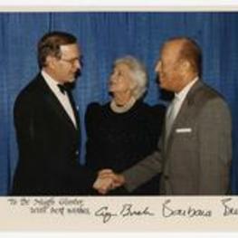 President Hugh Gloster with U.S.A. President George W. Bush and Mrs. Barbara Bush at the White House. Written on recto: To Dr. Hugh Gloster with best wishes, George Bush Barbara Bush.