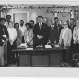 Members of the Mirror Grant Project stand with Atlanta Mayor Maynard Jackson. Written on recto: "Best wished to the A.U. Interdisciplinarians--Maynard Jackson 6/76."