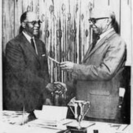 James P. Brawley shakes hands with the President of Morris Brown.