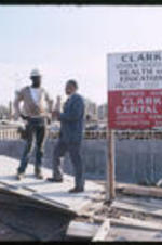 Unidentified construction worker and Dr. Vivian Wilson Henderson, president of Clark College, at the construction site of the Clark College Health and Physical Education building.