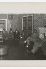 James P. Brawley and William Crogman sit in a semi-circle with other men.