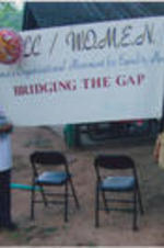 Ruby Shinhoster and Evelyn G. Lowery pose for a picture with a "SCLC/WOMEN Bridging the Gap" banner.