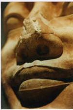 A close up of a statue's face.