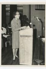 Dr. Jane Ellen McAllister speaks at a podium.