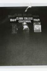 Three mementos with the Clark College seal with a sign that reads: 1869 Clark College Centennial 1969.