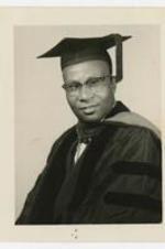 Portrait of George A. Sewell in graduation regalia; written on verso: Sewell A. George.