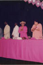 Rosa Parks (at left, first standing), Evelyn Occhino, Karen Lowery, Carolyn Watson (fourth thru second, from right), and others are shown applauding during the SCLC/WOMEN luncheon held as part of the 34th Annual Southern Christian Leadership Conference Convention in Birmingham, Alabama.