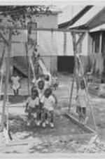Children play in the playground of the Gate City Day Nursery.