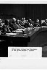 United Negro College Fund Presidents visit the United Nations. Written on recto: United Negro College Fund Presidents at the United Nations - 3/18/55.  Written on verso: "(VIS:USA:55) PRESIDENTS OF THE NEGRO COLLEGES AND UNIVERSITIES VISIT U.N. UN 45439 - UNITED NATIONS, N.Y., 18 March 1955 - The 33 Presidents of the members of the colleges and universities of the United Negro College Fund this afternoon visited United Nations Headquarters, in New York. Some of them are seen here in one of the U.N. conference rooms, as they were listening to a short welcoming address by Secretary-General Dag Hammarskjold. Their visit was organized by the United States Mission to the U.N.  Please credit: UNITED NATIONS  AF/pcd.
