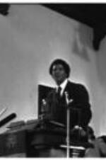 Maynard Jackson speaks to people in a church.
