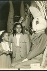 Brailsford R. Brazeal's daughters, Aurelia Erskine and Ernestine Walton Brazeal, visit the Easter Bunny at Bunnyland.