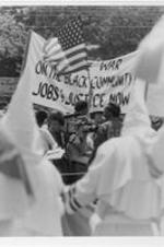 Ku Klux Klan (KKK) members and anti-KKK protesters at a KKK demonstration in College Park, Georgia.