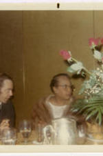 Hallie Brooks sits at a table. Written on recto: Jun 69