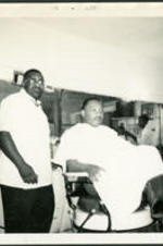 Martin Luther King Jr. at the barber shop.