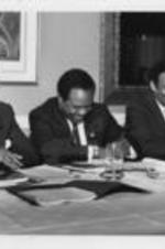 Joseph E. Lowery, Walter E. Fauntroy, Andrew Young and John Nettles are shown sharing a laugh during the Southern Christian Leadership Conference Spring Board meeting in St. Petersburg, Florida. Written on verso: All work... And no play??